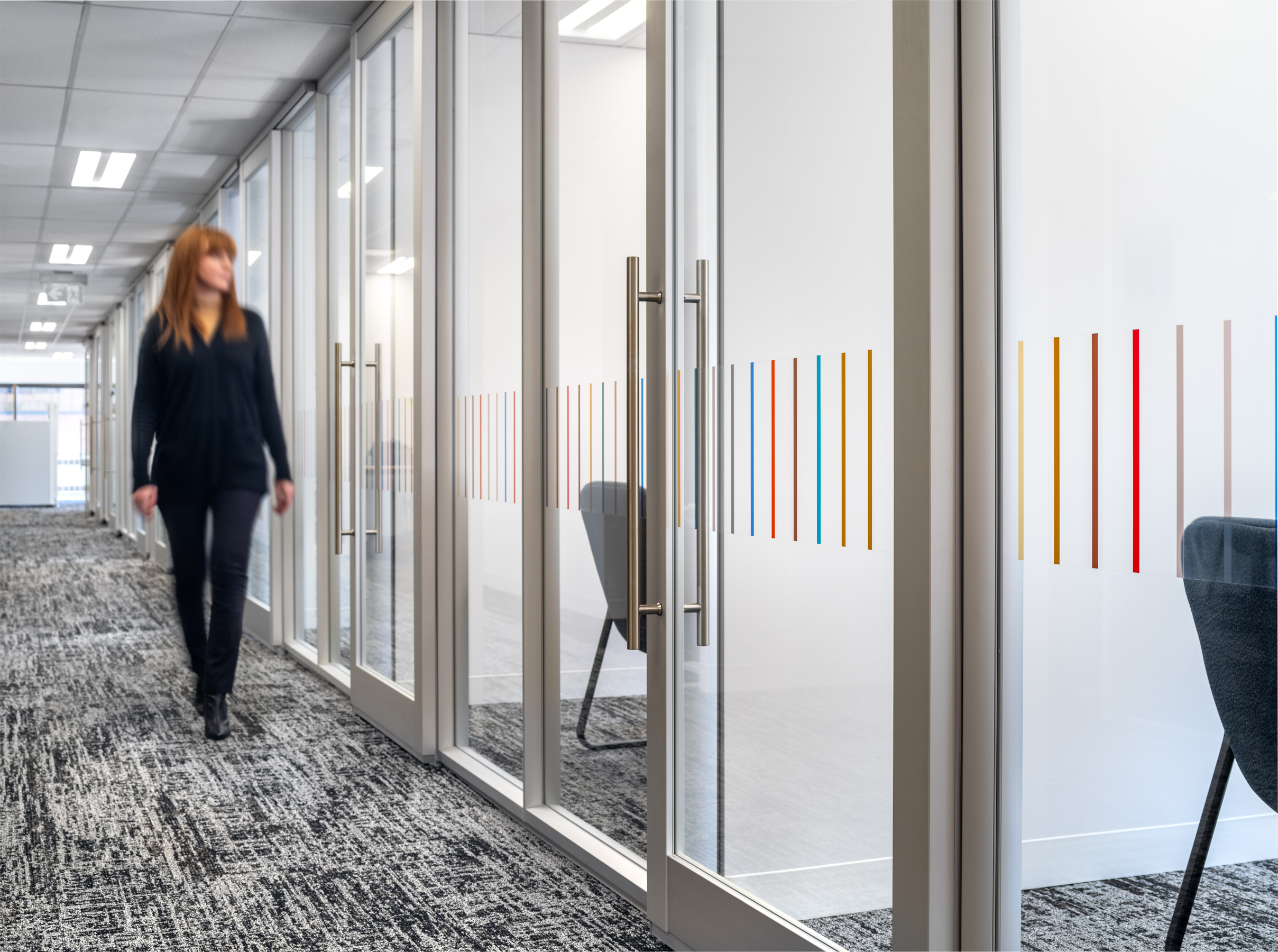 LAA employee walking through the halls at the Legal Aid Alberta office