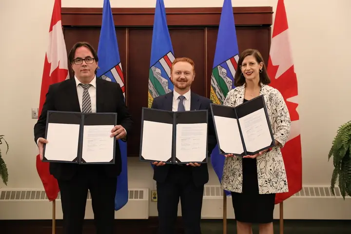 Left to right: Ryan Callioux, KC, board chair, Legal Aid Alberta: Mickey Amery, KC, Minister of Justice and Attorney General: Deanna Steblyk, KC, president, Law Society of Alberta. 